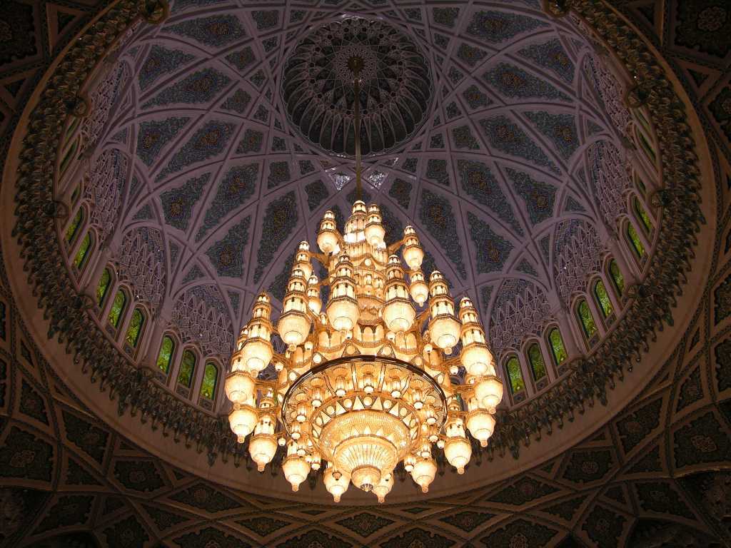 Muscat 04 Grand Mosque 05 Chandelier Hanging From Central Dome The main prayer hall has a large ornate chandelier made of Swarovski crystal and gilded metals hanging from the central dome, which  rises to a height of 50m above the floor.